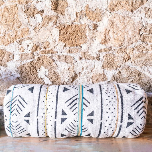 Traversin décoratif en textile africain avec garniture en soie